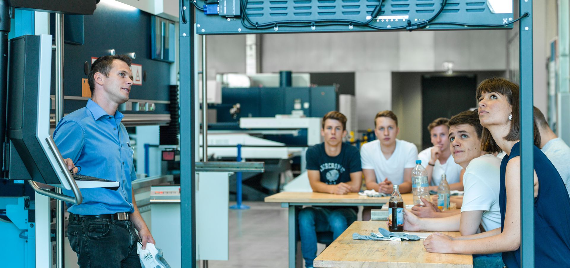 TRUMPF apprentice listening to a lecturer
