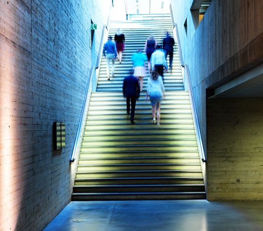 TRUMPF employees walking up-stairs