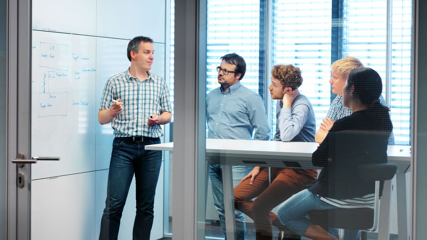 TRUMPF employees from the software development department in a SCRUM meeting